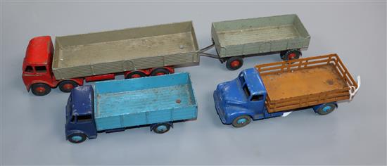 Three Dinky flat beds (blue Guy, brown-blue Leyland Comet and red and green fodder with trailer Longest 32cm